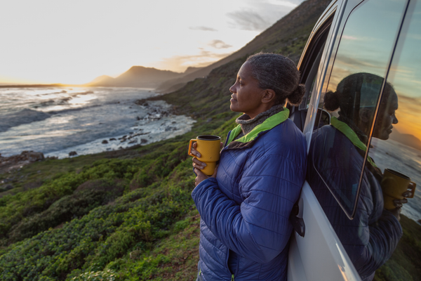 woman enjoying the coast in celebration of Earth Day 2026