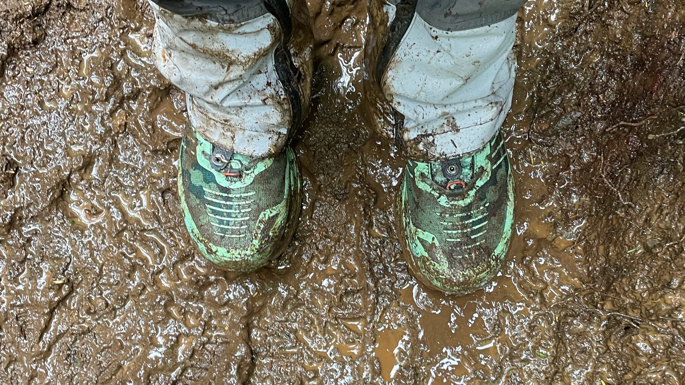 waterproof hiking boots covered in mud