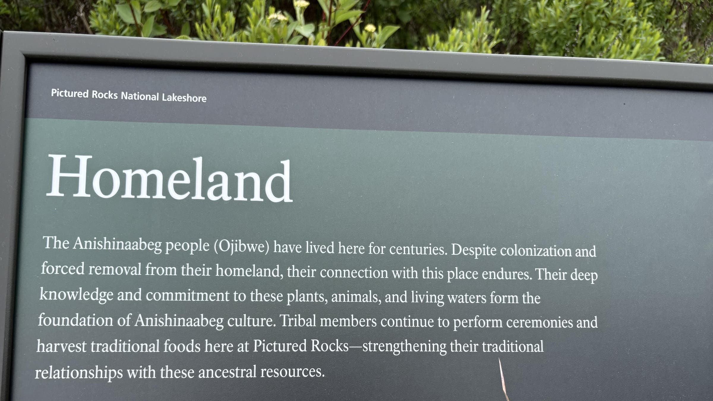 A sign at Pictured Rocks National Lakeshore flagged for language related to colonization