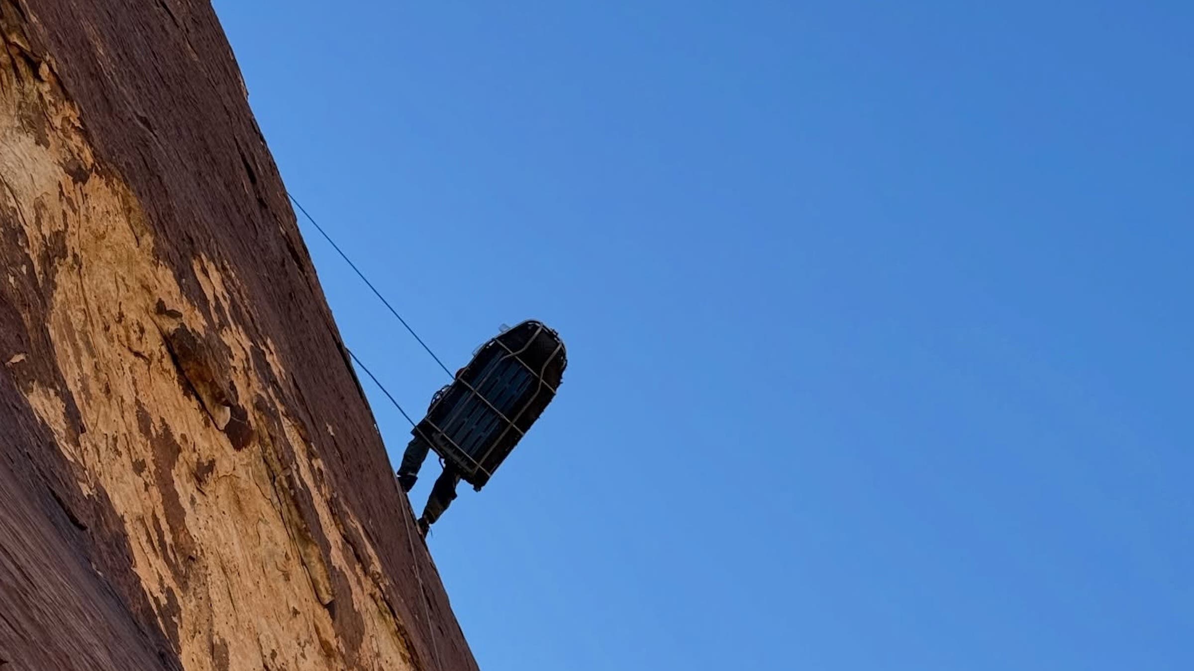 Rescuers say the climber's helmet likely saved their life