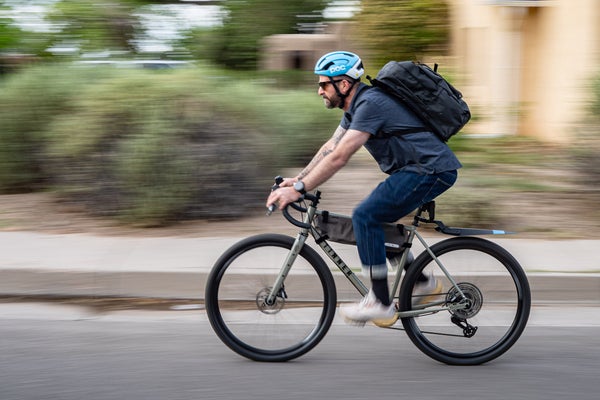 Author Jakob Schiller riding his bike to work wearing bike commuting gear and accessories for a safer, more comfortable ride