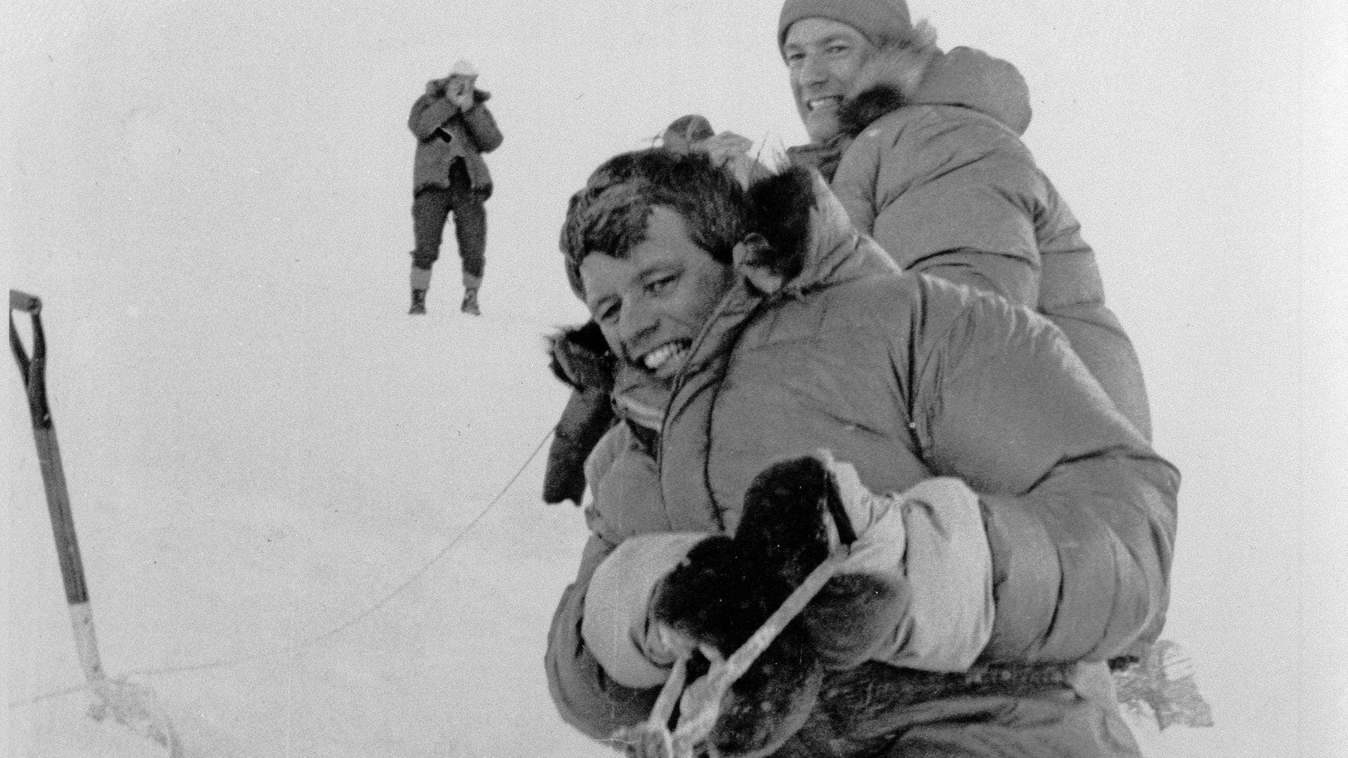 Robert Kennedy and Whittaker pull on a tow line to help free a stuck ski plane at the base site at Mount Kennedy in Yukon Territory 150 miles west of Whitehorse, Canada, in 1965