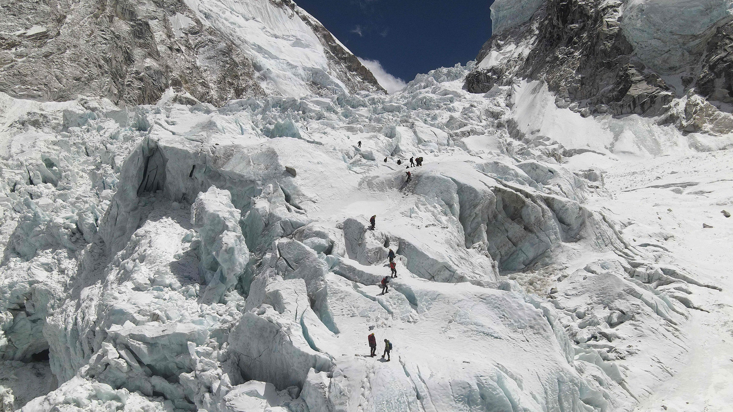 Climbers ascend the Khumbu Icefall