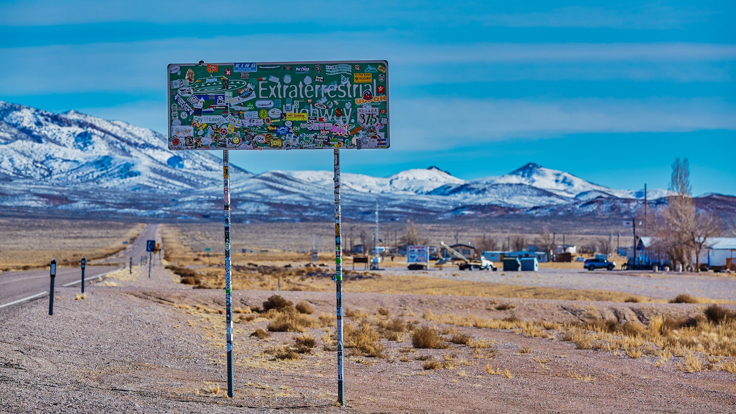 a sign covered in stickers