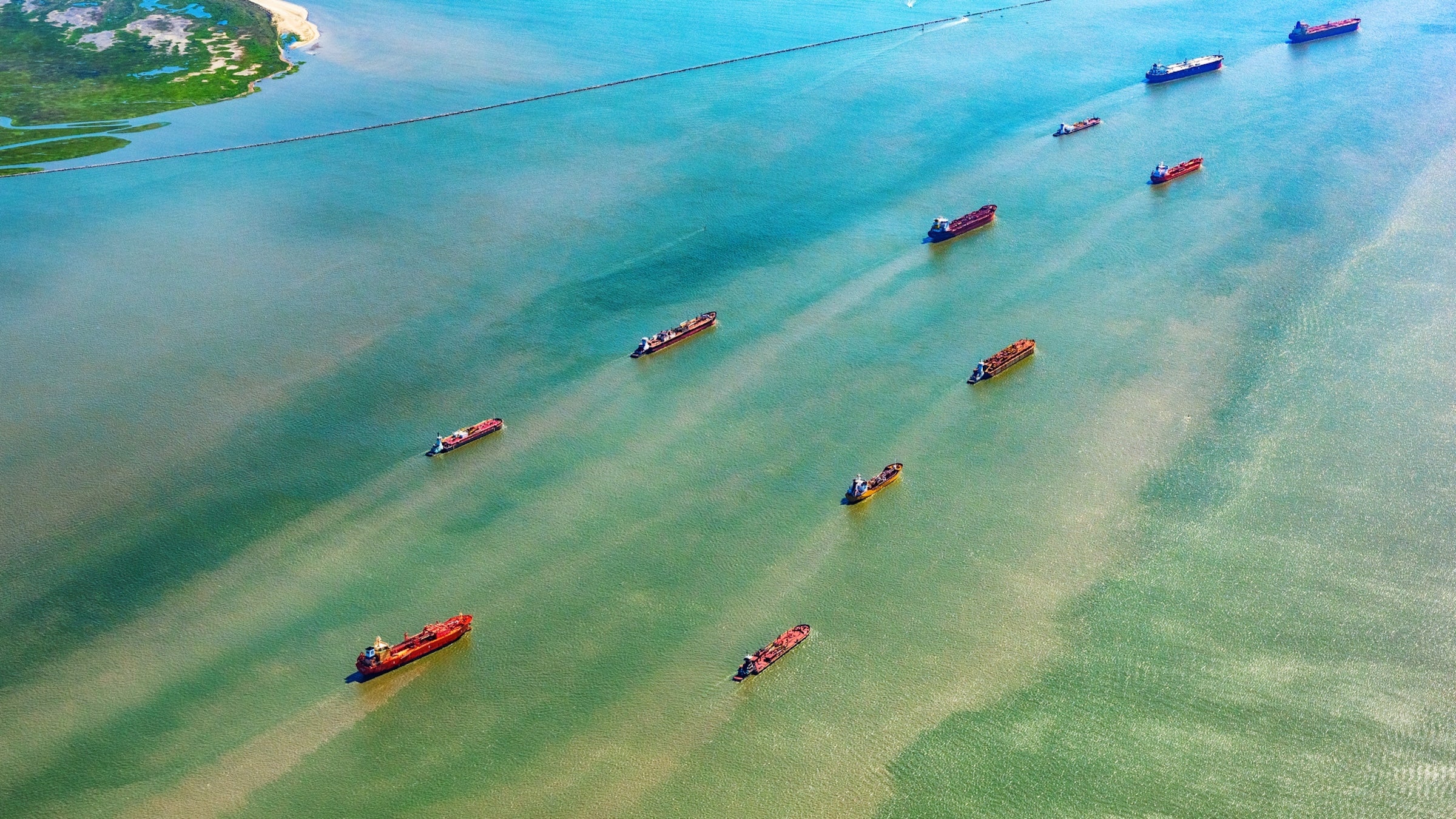 Large group of oil tankers entering Galveston Bay in Texas from the Gulf of Mexico