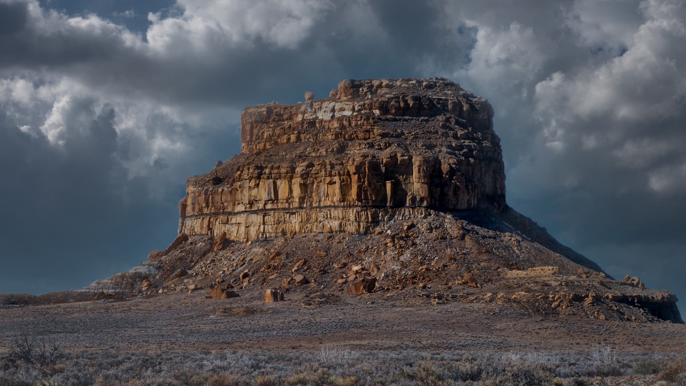 Chaco Canyon was the center of Ancestral Puebloan culture between AD 850 and 1150 a butte is shown against a cloudy sky