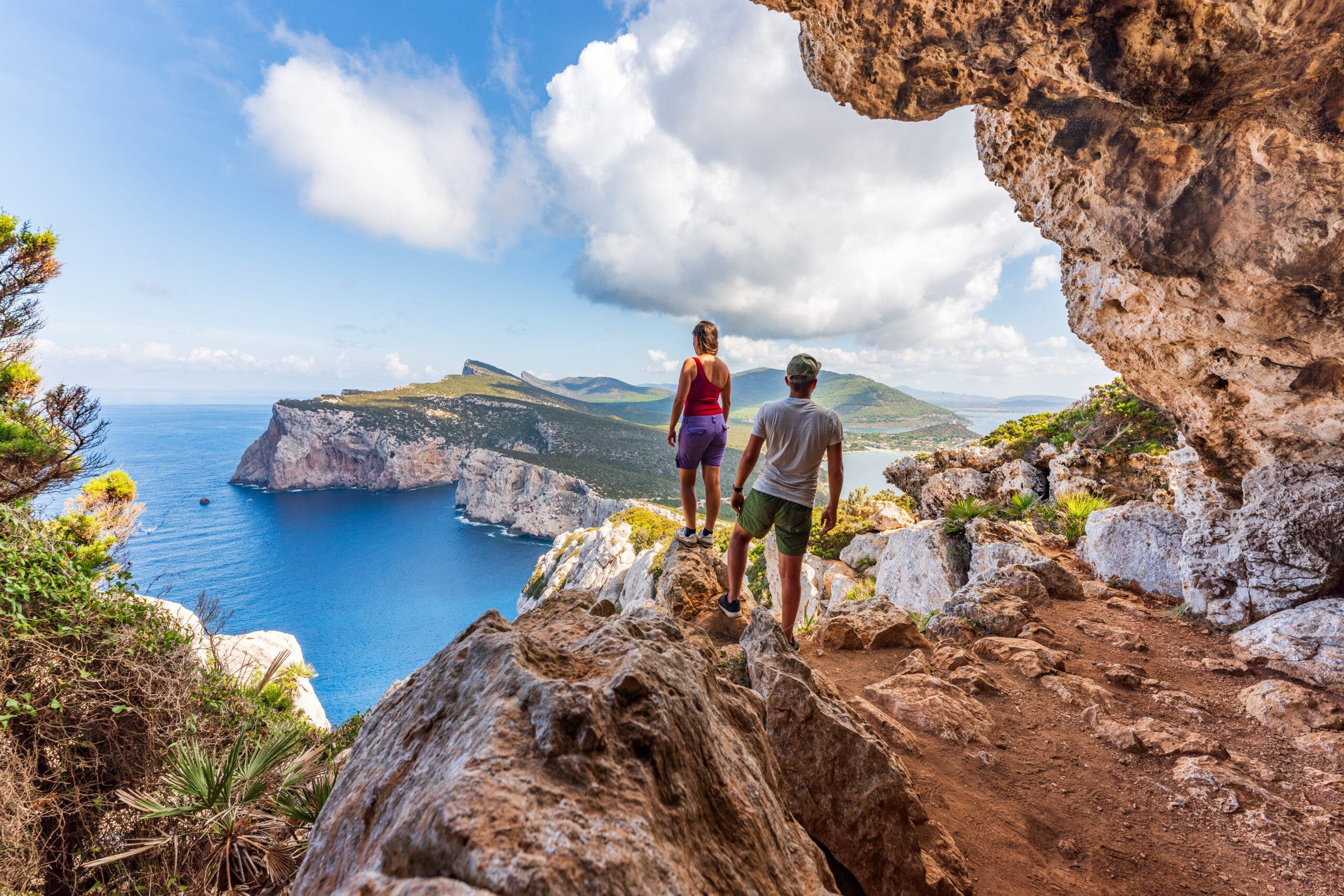 Couple admiring the coastline of Sardinia, Italy