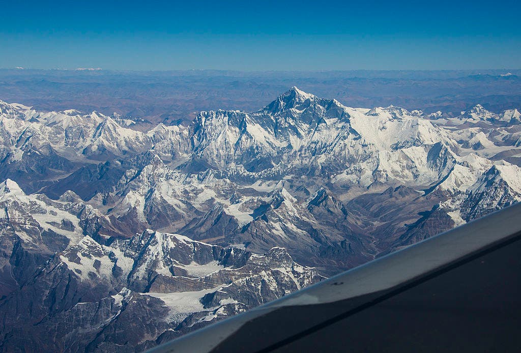 The Himalayas tower above the plains