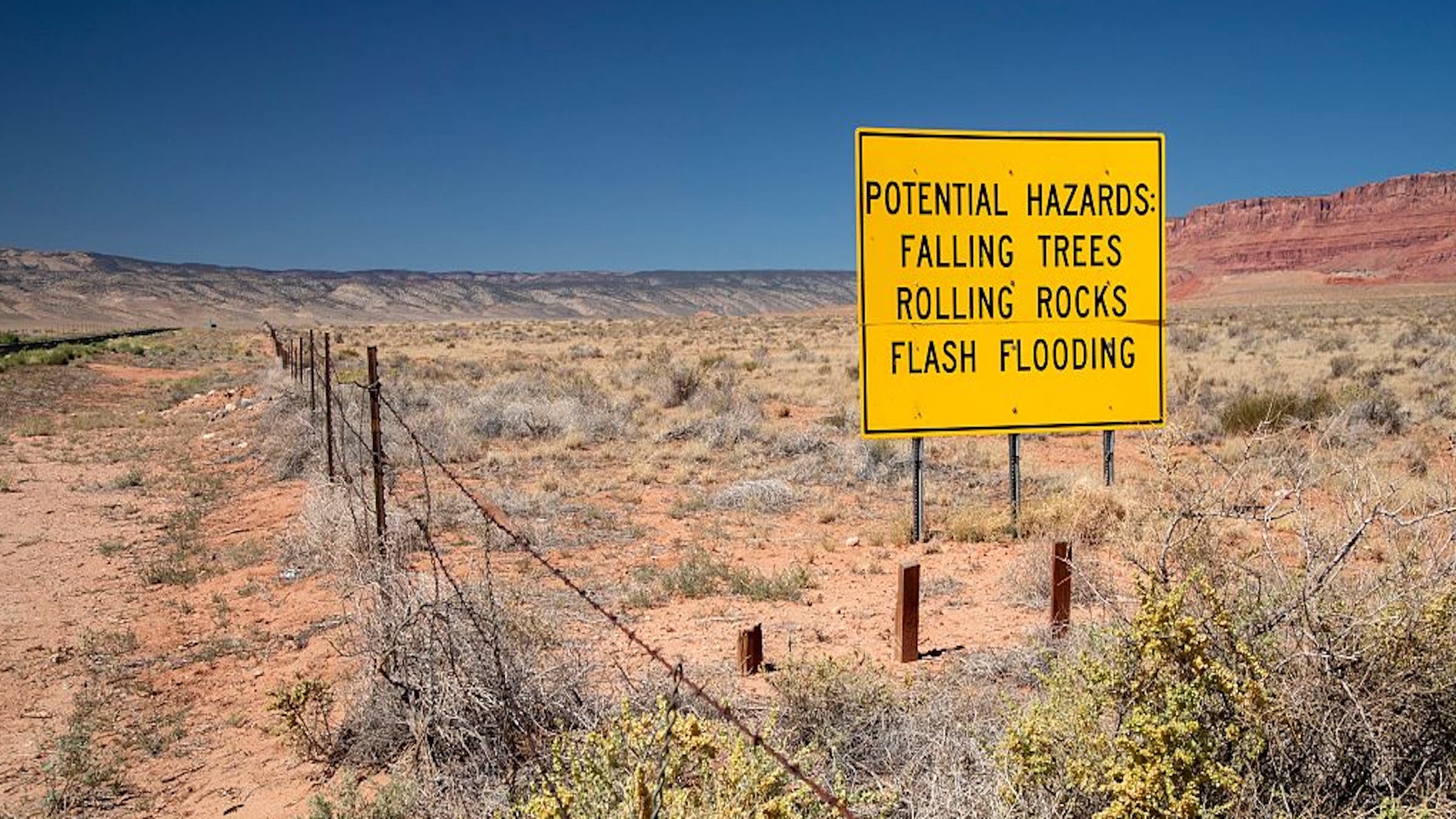 A roadside sign warns of the hazards motorists may face as they approach the burn zone of the Dragon Bravo fire