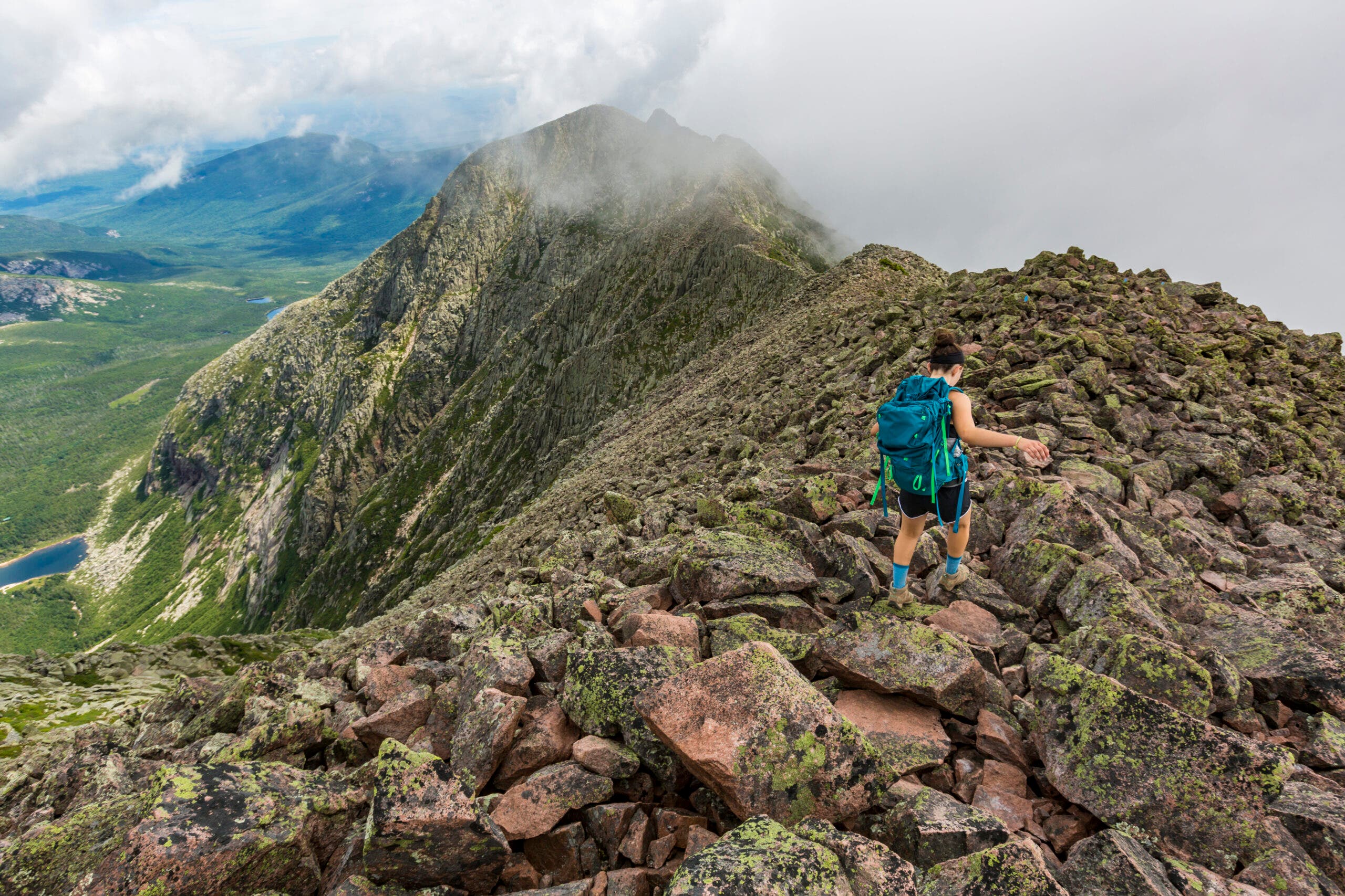 The Knife Edge Trail on Mount Katahdin in Maine's Baxter State Park is a renowned and treacherous 1.1-mile ridge trail that connects Pamola Peak to Baxter Peak, the highest point in Maine.