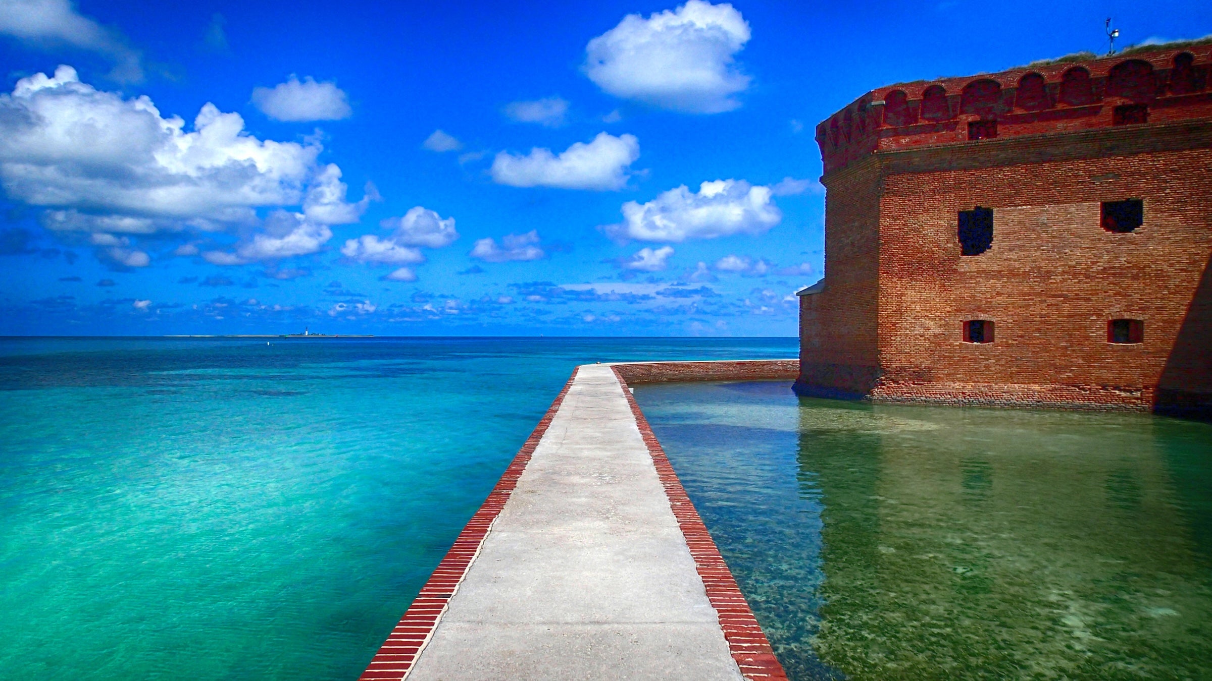 the walls of fort jefferson shown against the turquoise atlantic waters of dry tortugas national park