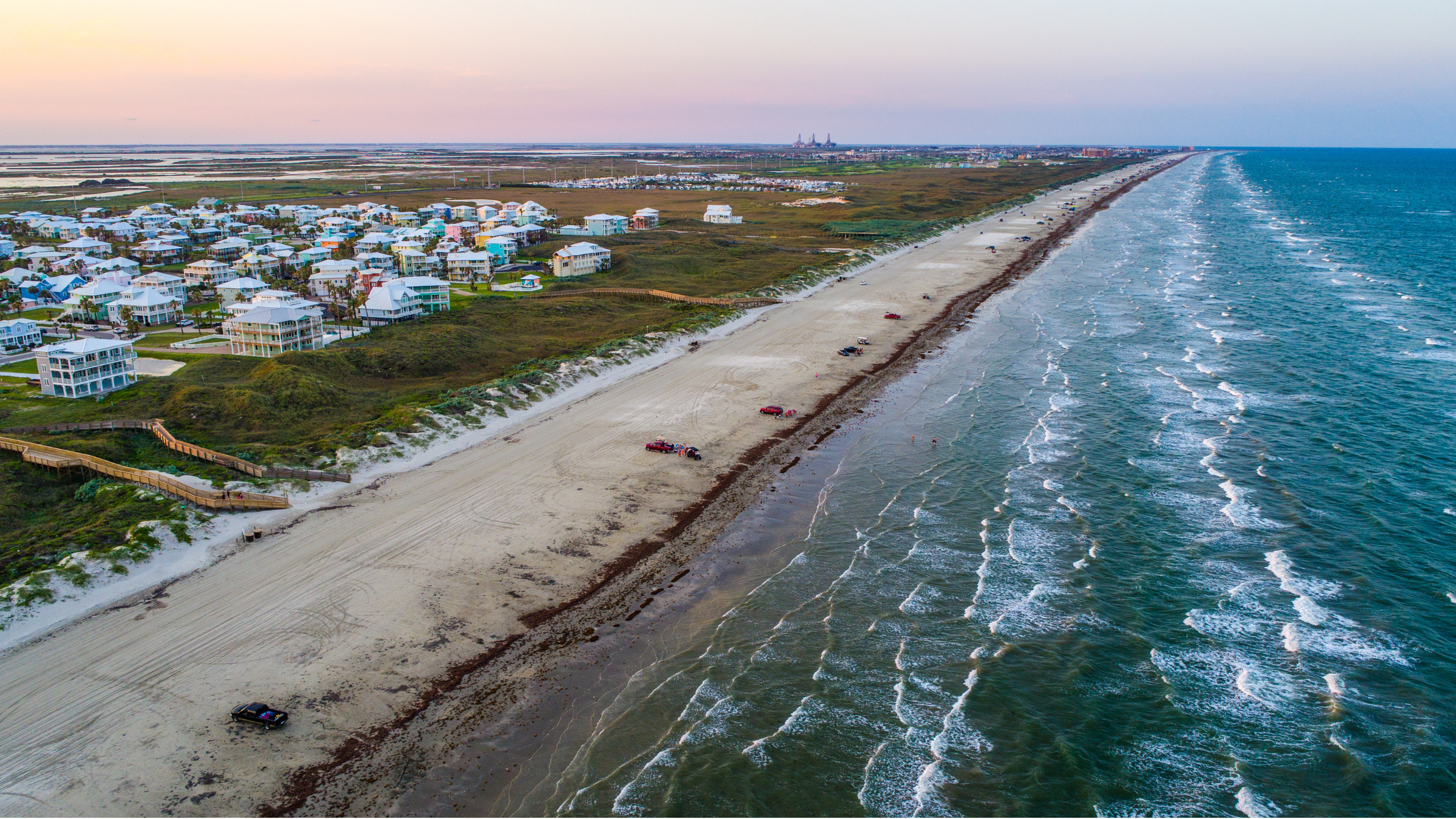Families beach camping on Padre Island on a colorful evening