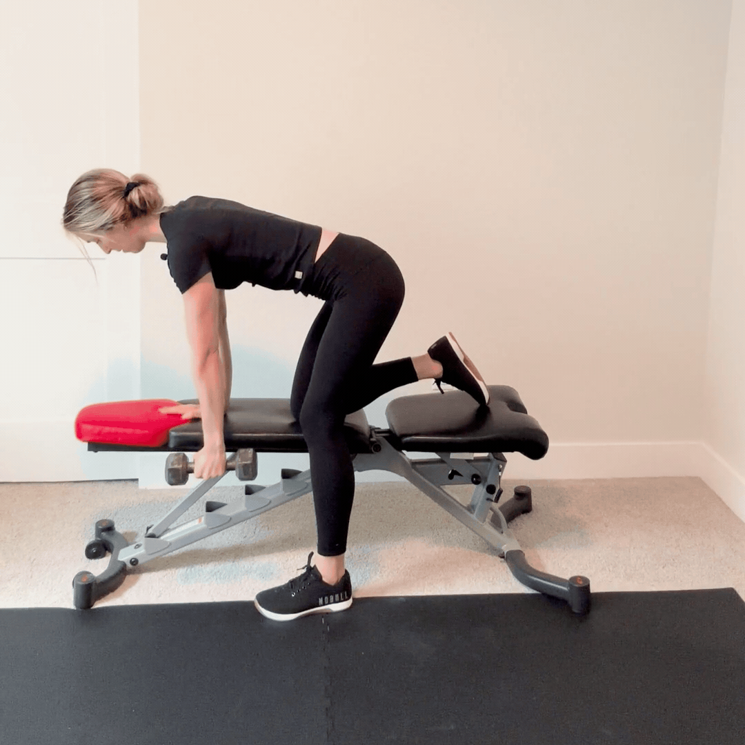 person doing a single arm bent over row exercise