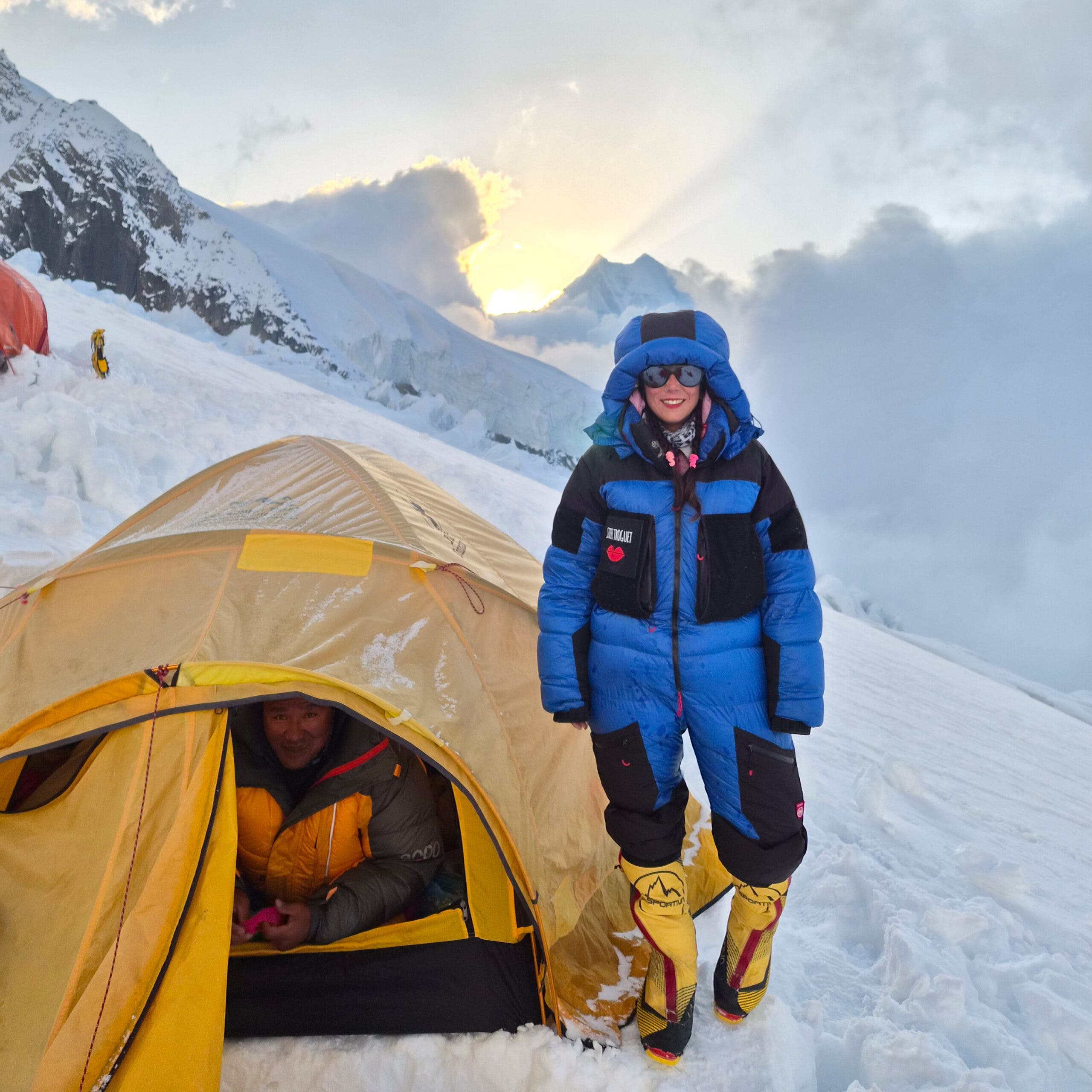Two climbers in front of their tent on Annapurna