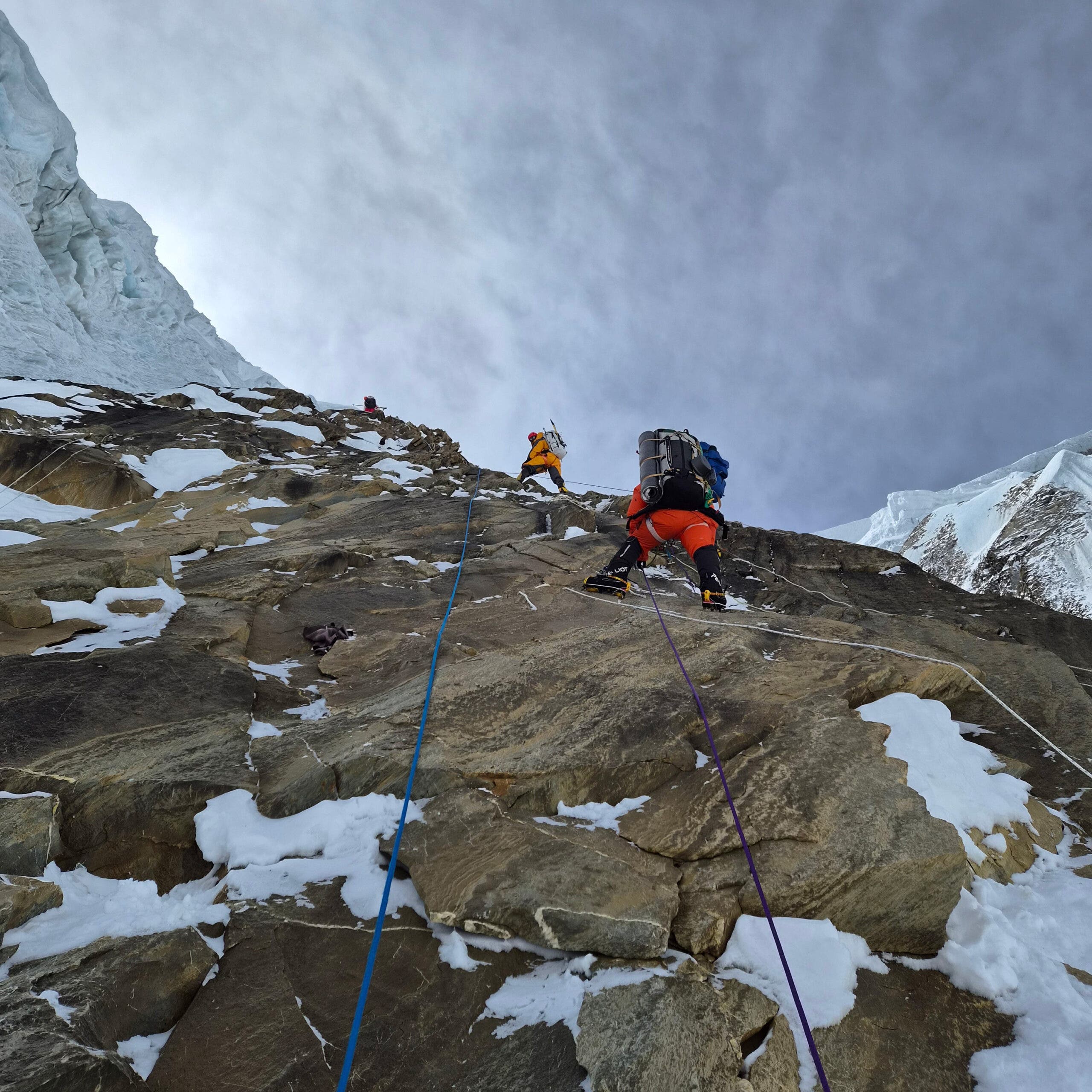 Climbers navigate a sheer wall on Annapurna 