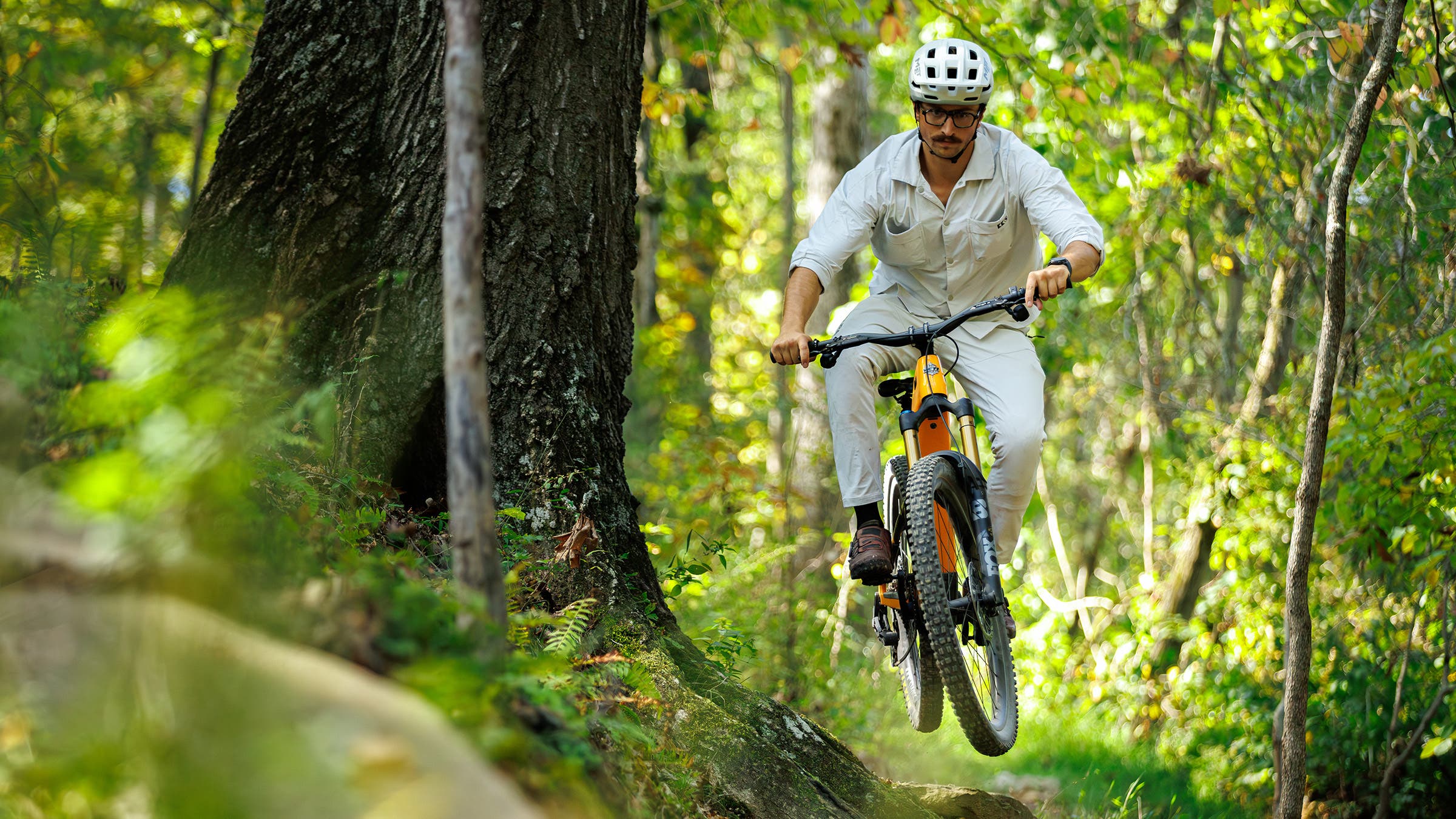 Mountain biker mid-jump on Yeti LTe electric mountain bike during the Pinkbike Field Test