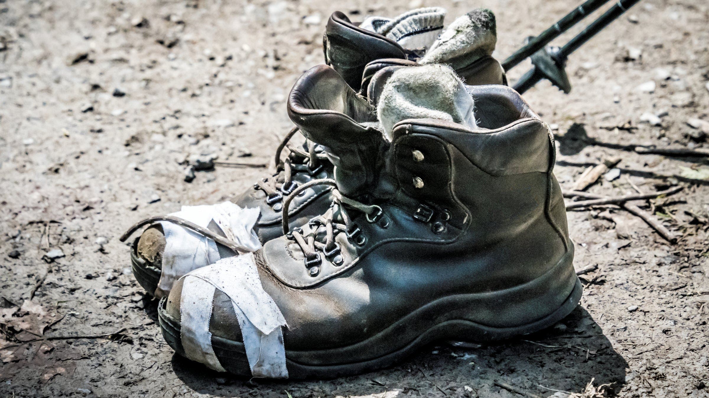 old boots held together by tape