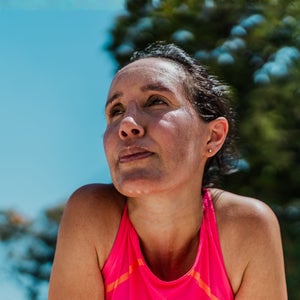 Tired mature woman sweating during sports activity