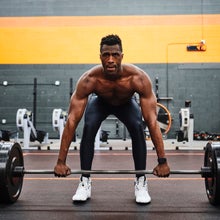 man in gym preparing to lift