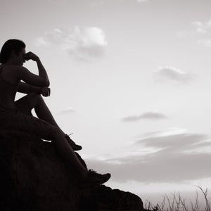 person lonely sitting outside