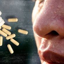 supplements next to a sweaty person's face