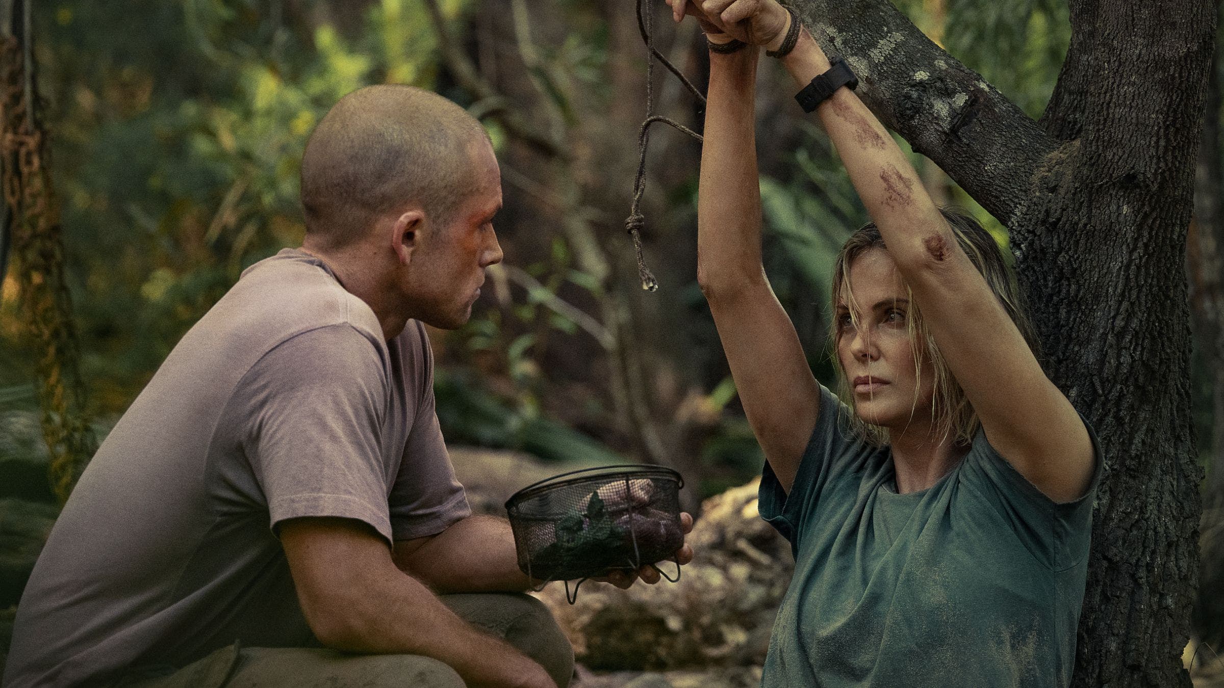 taron and charlize close up in 'Apex'