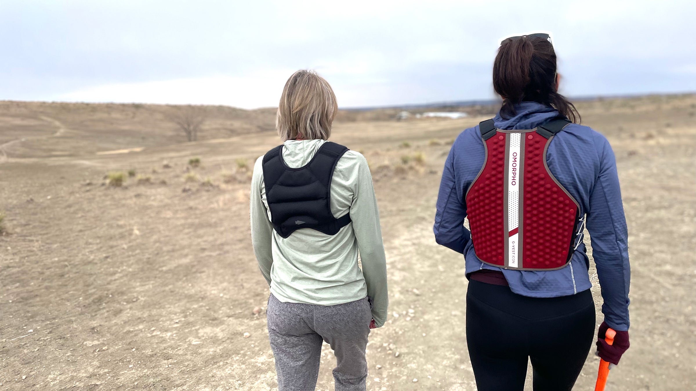 Author Lisa Jhung and another tester walk in desert testing weighted rucking vests for hiking.