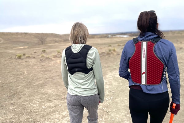 Author Lisa Jhung and another tester walk in desert testing weighted rucking vests for hiking.