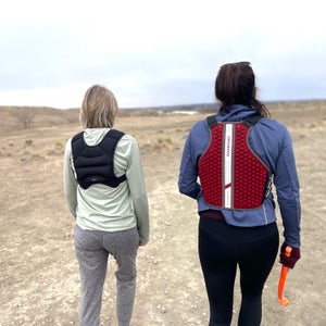 Author Lisa Jhung and another tester walk in desert testing weighted rucking vests for hiking.
