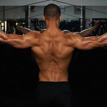 man's strong back with weights