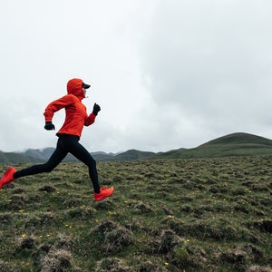 woman running outdoors in red
