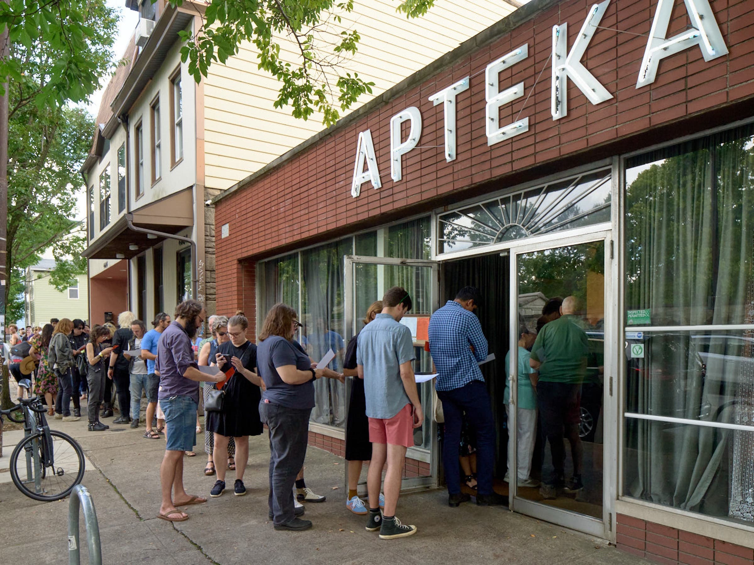 a line of patrons out the door at Apteka, a restaurant about foraging in the rust belt