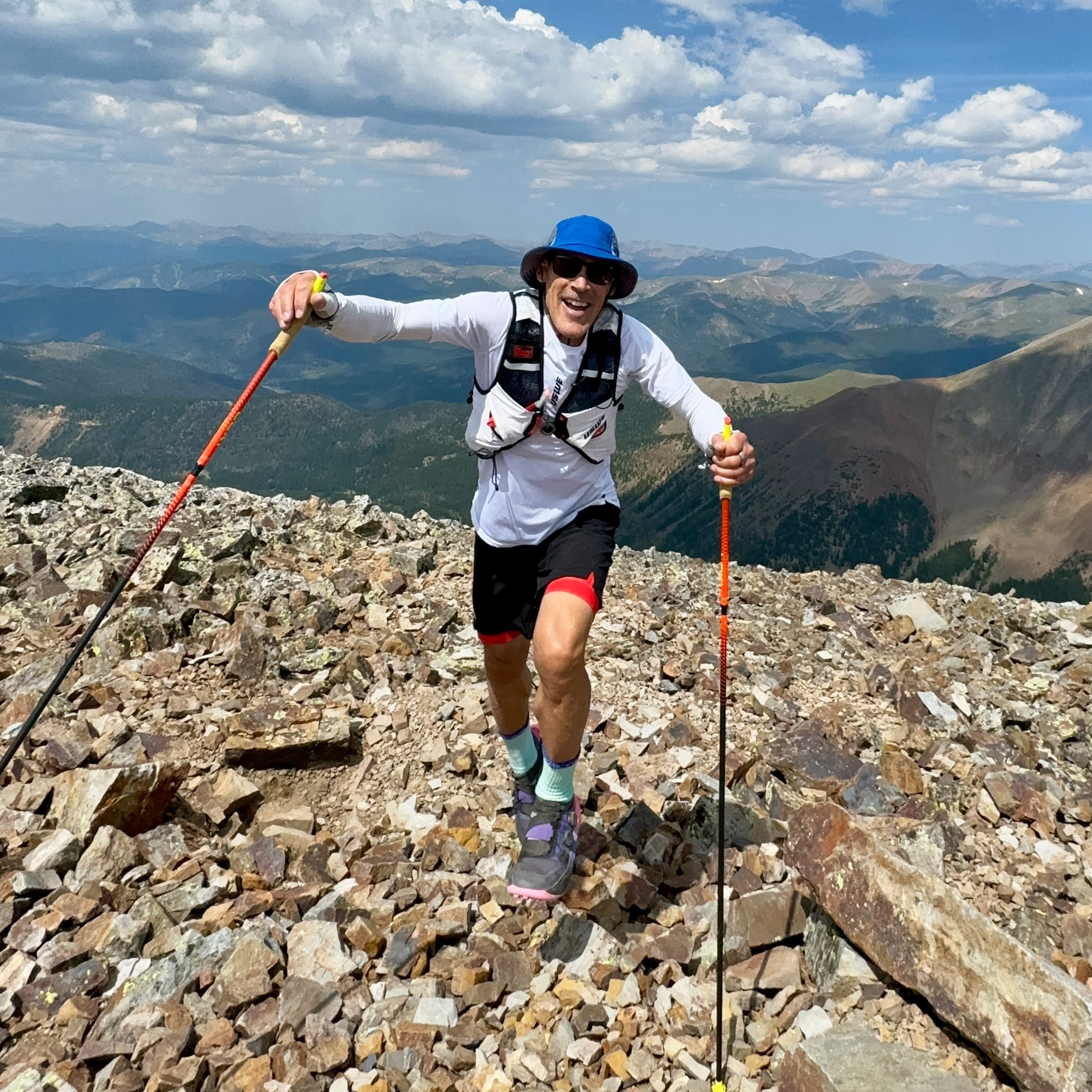 Dean Karnazes hikes up a rocky slope