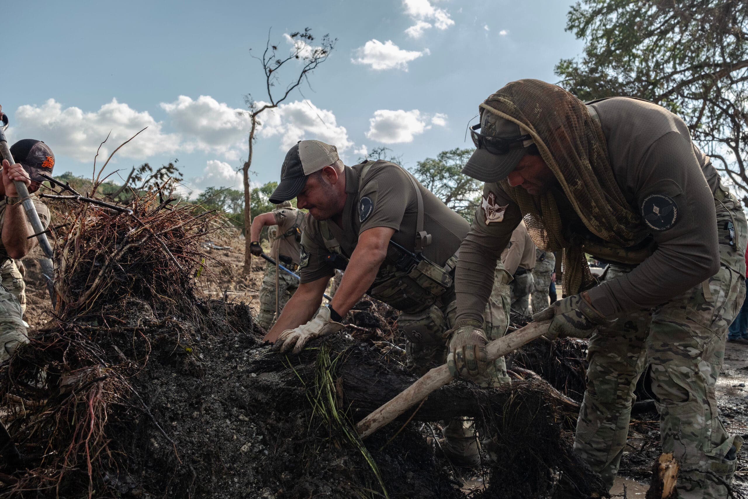 Searchers dig into mud