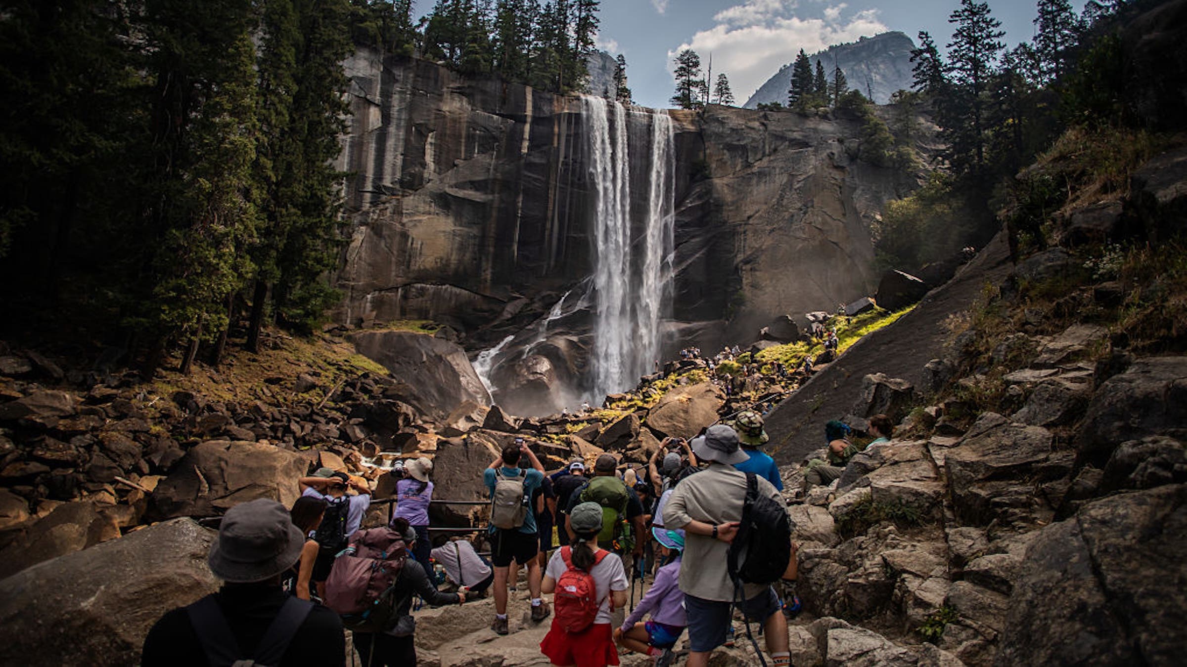 Visitors hike the Mist Trail toward Vernal Falls on August 31, 2025 in the Yosemite National Park, California