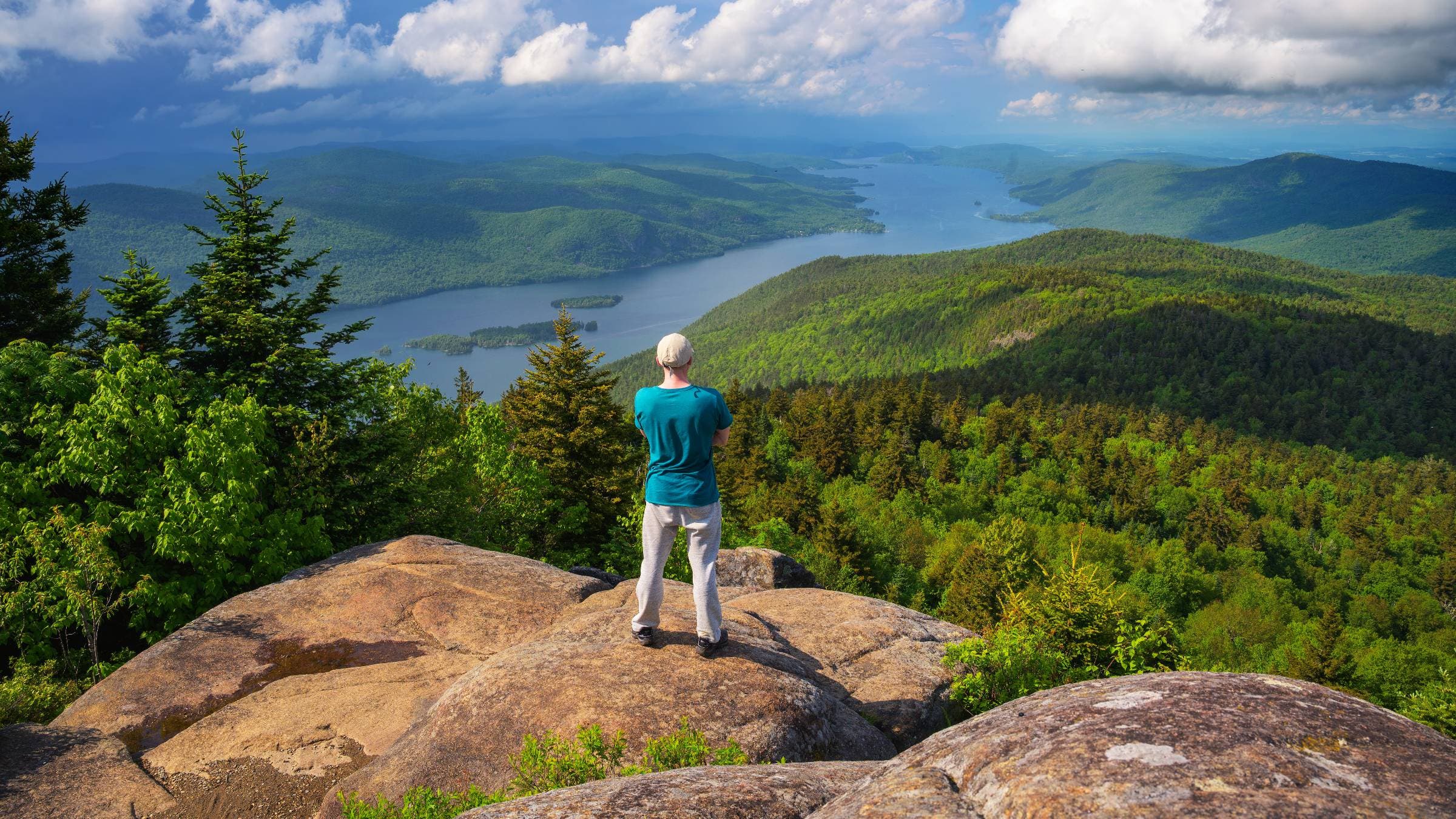 Hiker on Black Mountain Overlooking Lake George, New York.