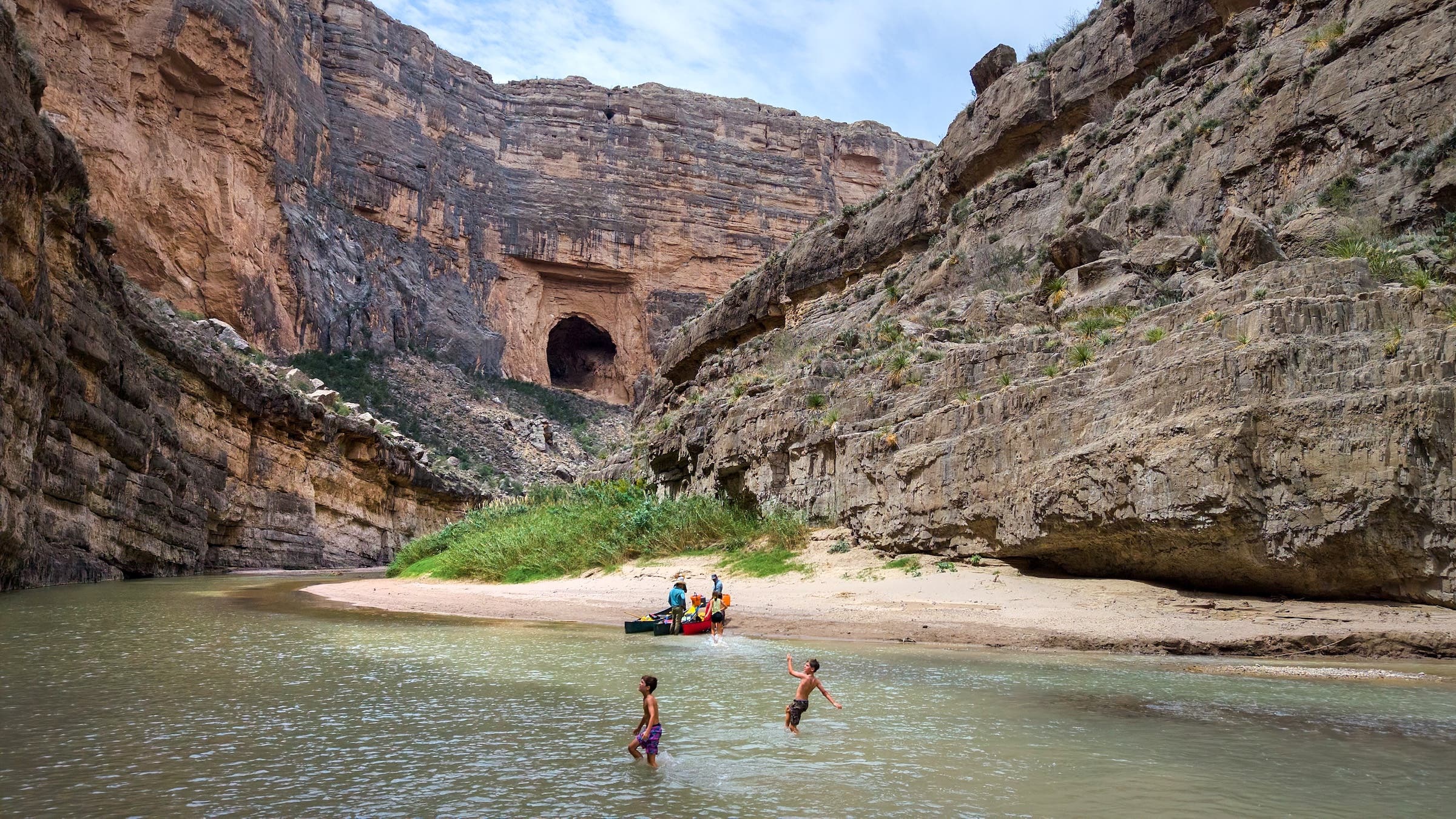 In an aerial view, a family stops for swimming in the Rio Grande during a guided canoe trip through the Santa Elena Canon in Big Bend National Park, Texas.