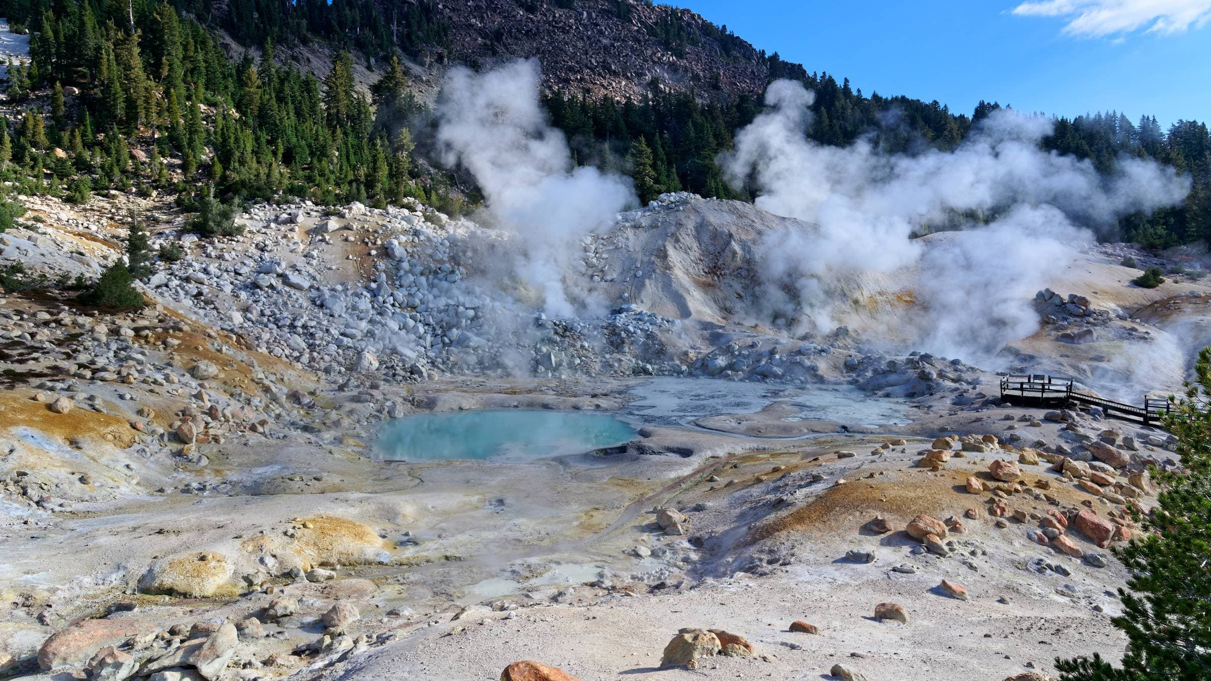 Landscape view of the geothermal features of Bumpass Hell in Lassen Volcanic National Park.