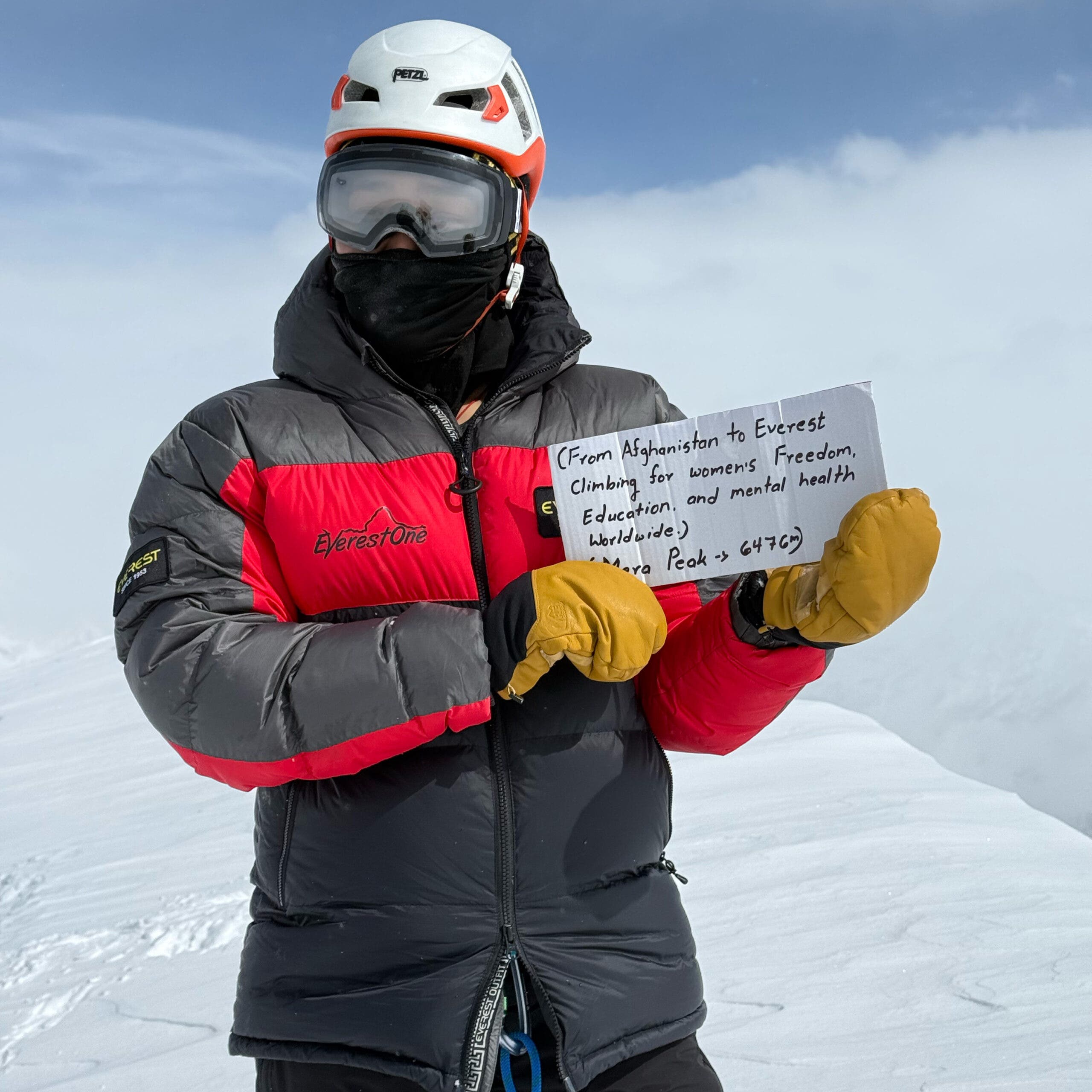 A woman atop Mera Peak