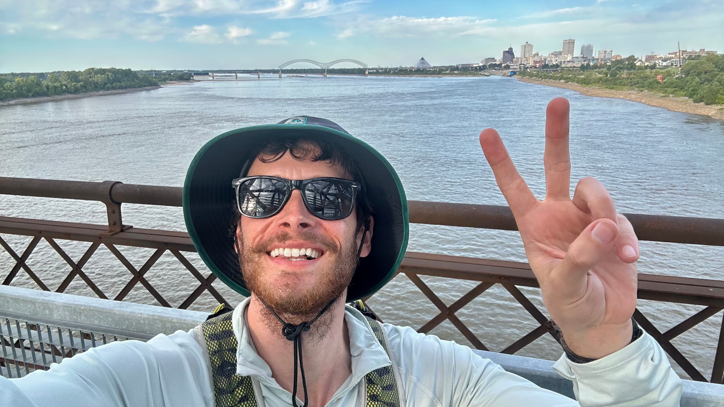 Greg Nance taking a selfie while on a bridge over the Mississippi River.