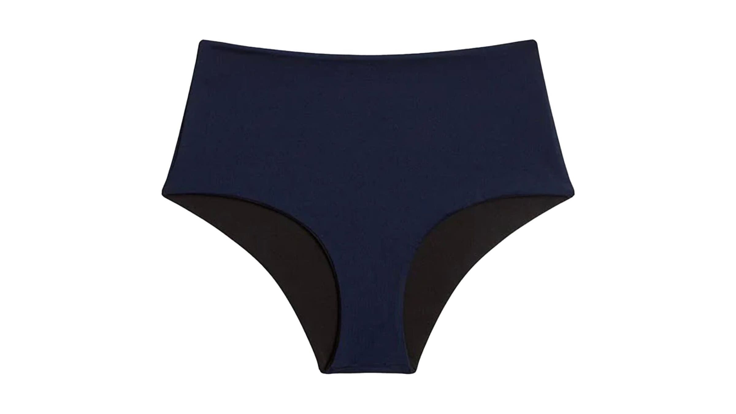 dark blue with black liner Carve Designs Erin Reversible active bikini bottom on white background