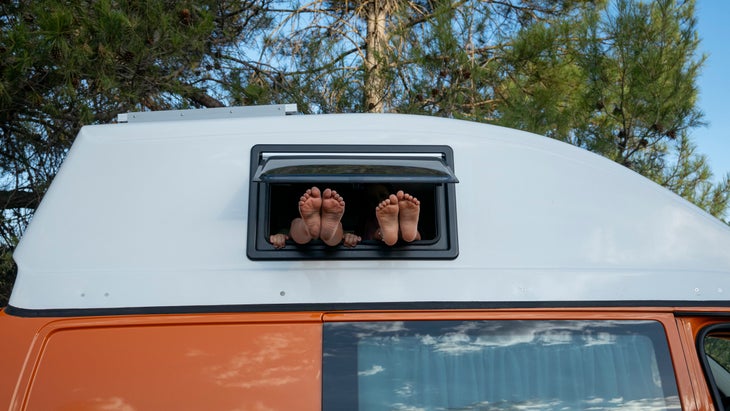 feet sticking out of camper van window