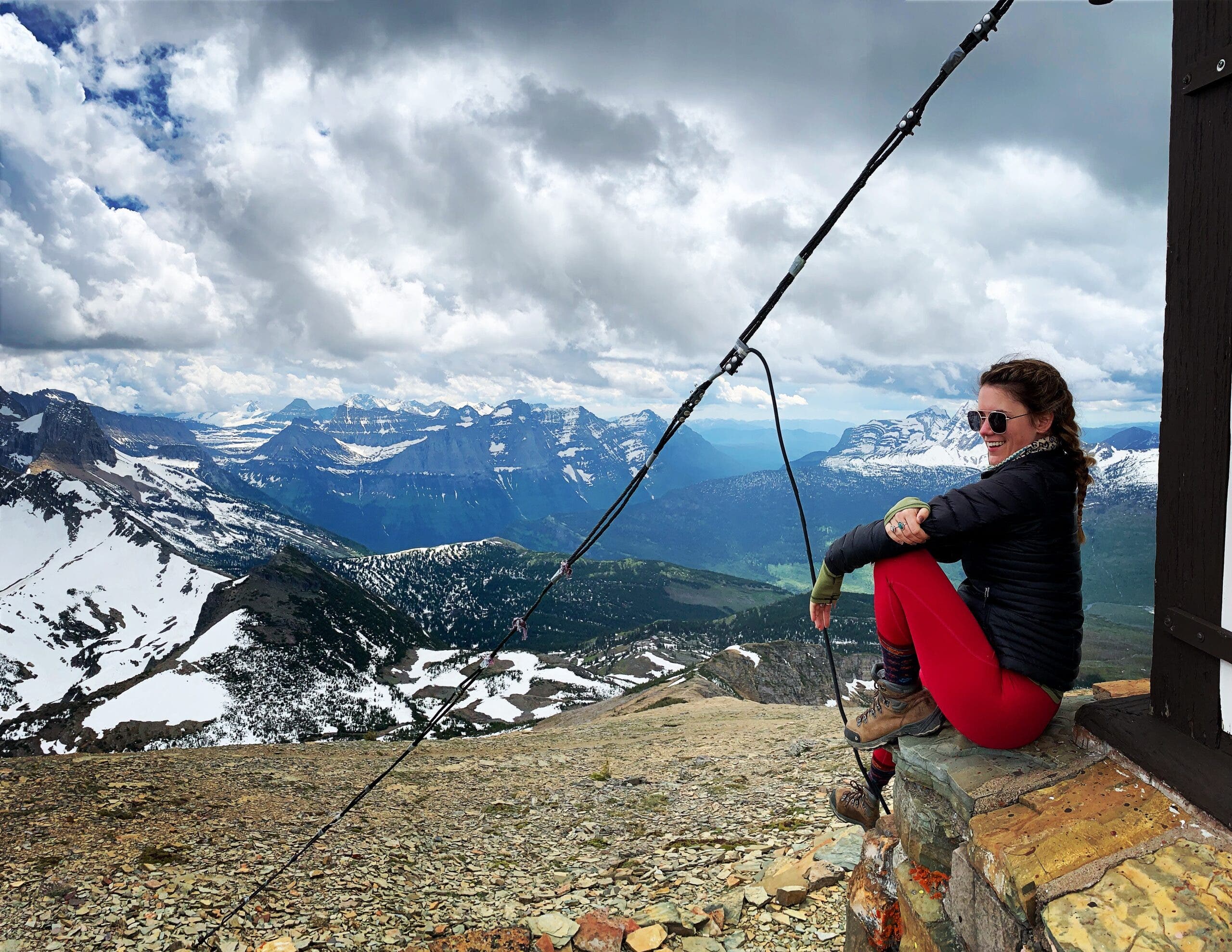 The author sits at Swiftcurrent Fire Lookout in Glacier National Park. The trailhead leading to the lookout begins at Granite Park Chalet, the location of a 1967 fatal grizzly attack.