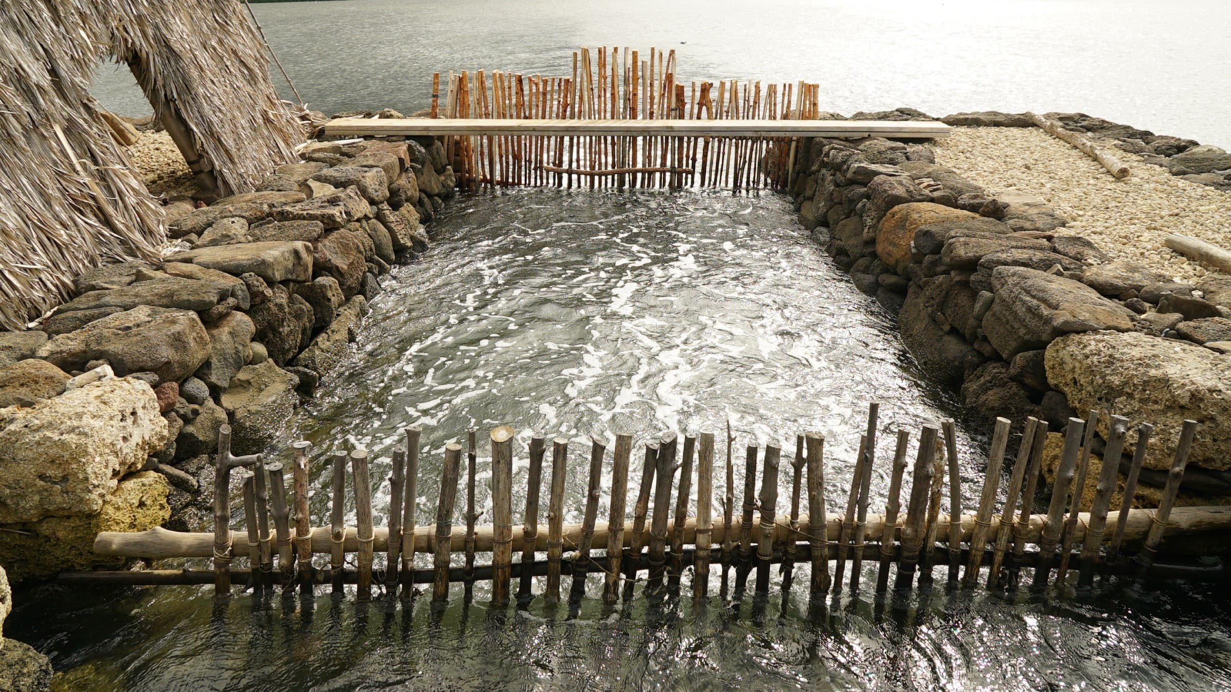 Wooden gates in water.