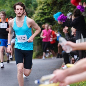 man and woman racing marathon