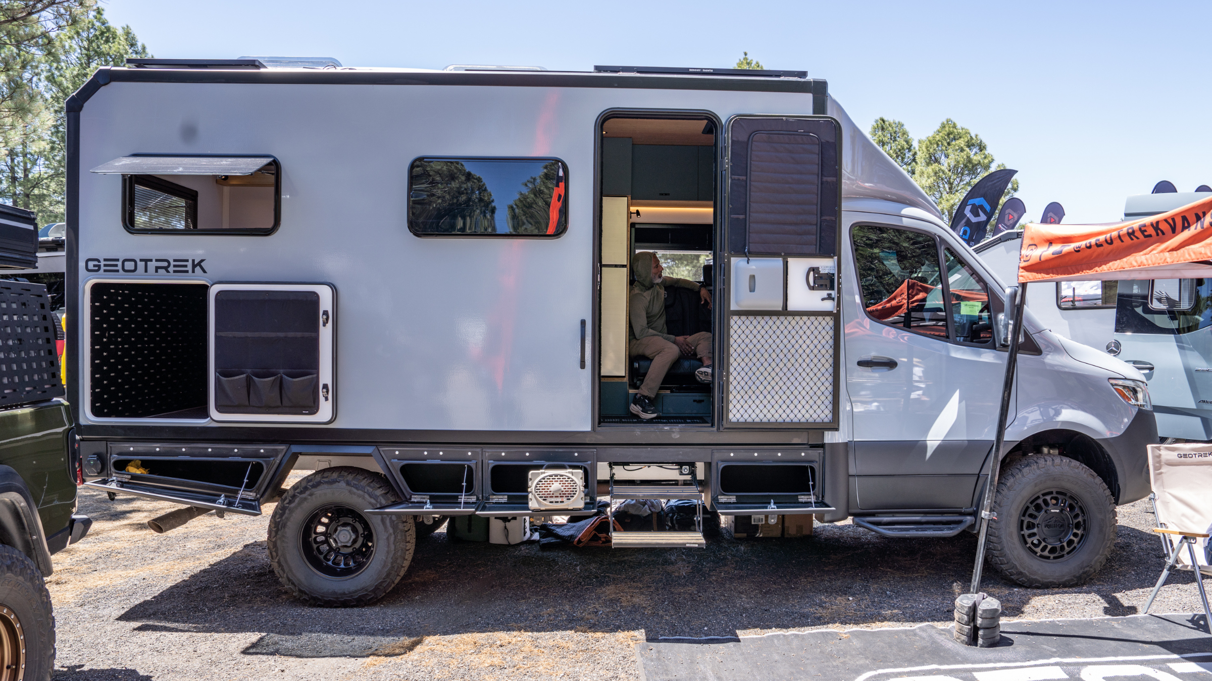 side view of Geotrek Class B+ vehicle parked outside at Overland Expo West 2026