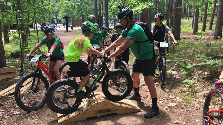 Todd Poquette pictured teaching 906 Adventure Club members how to face obstacles on the track