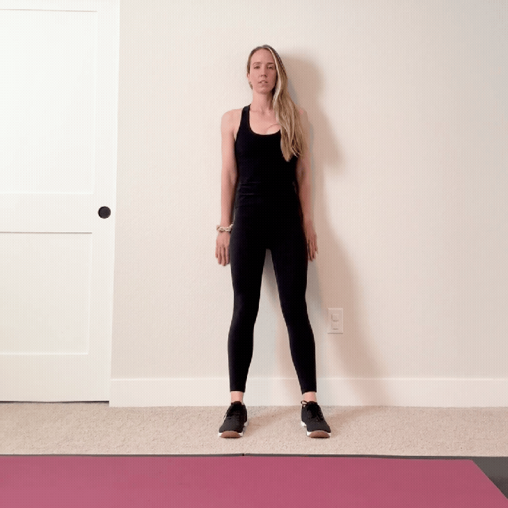 person doing a wall sit exercise