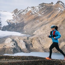 woman running by mountains