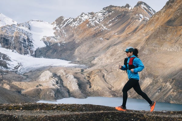 woman running by mountains